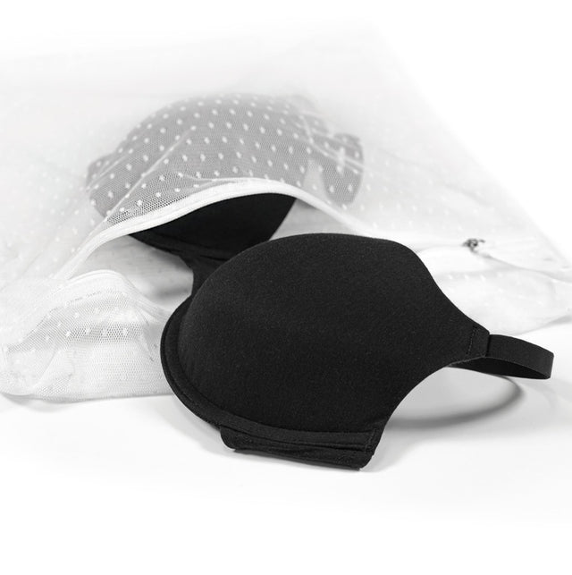 Black underwire bra shown in protective care wash bag