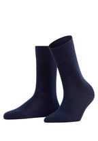 Pair of navy blue socks on a white background
