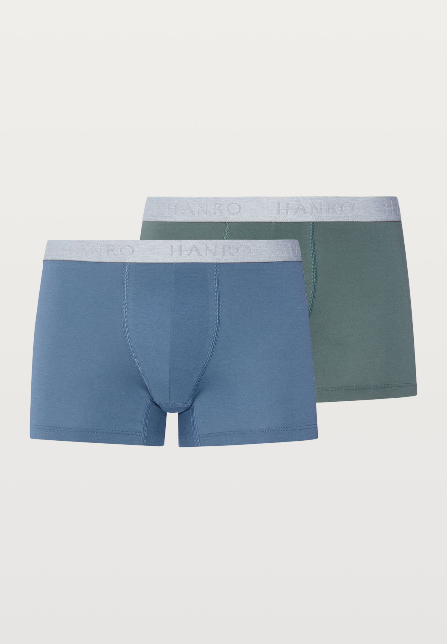 Two pairs of men's boxer briefs, one blue and one green, with 'HANRO' branding on a white background.