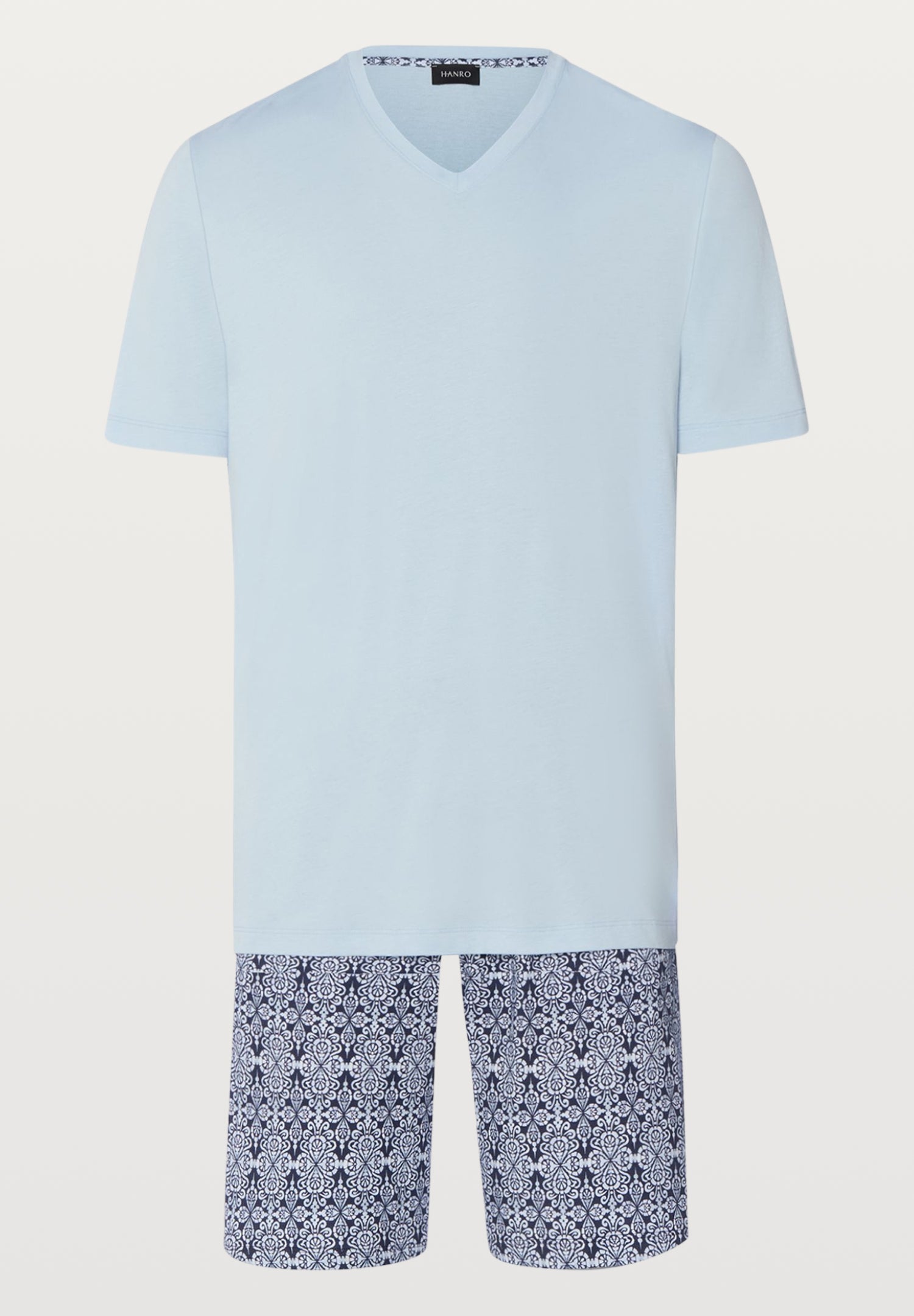 Light blue t-shirt and patterned shorts set on a white background