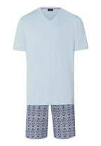 Light blue pajama set with floral shorts on a white background