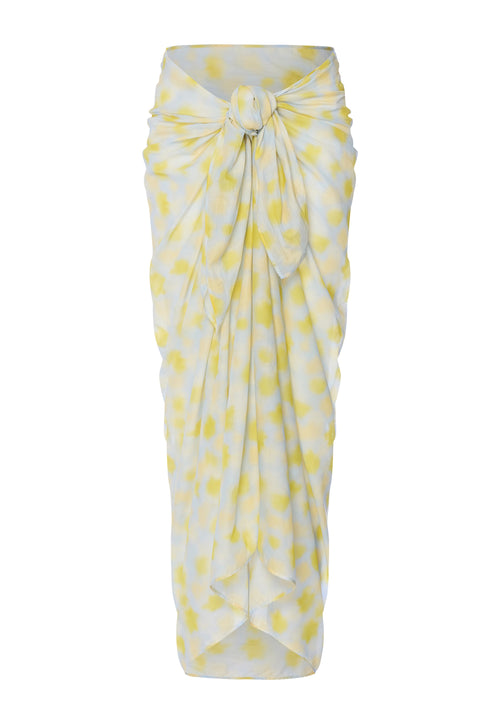 Yellow and white patterned pareo on a white background