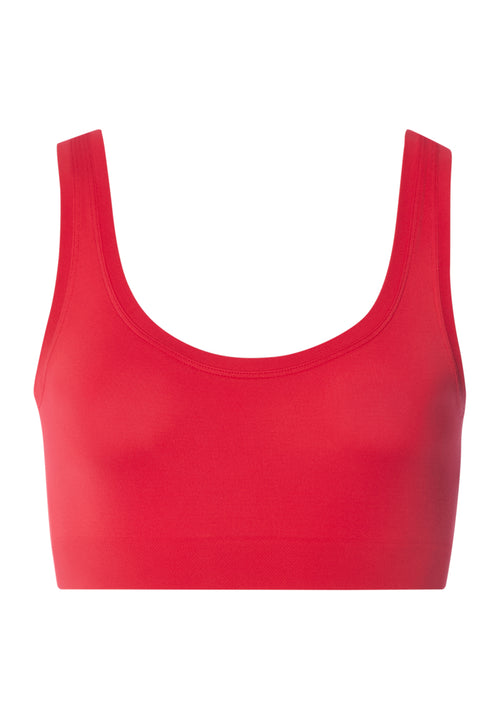 Red sports bra on a white background