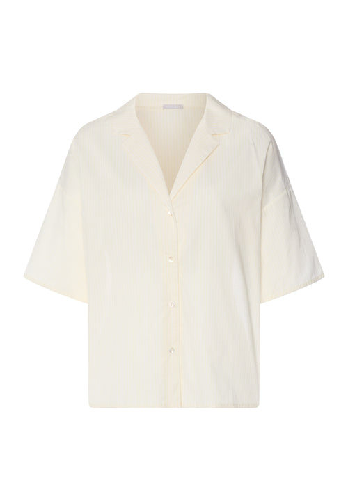 Light yellow blouse on a white background