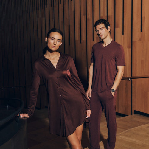Two people wearing Grand Central Sleep Shirt and Casuals Shirt and pants in vivid brown.