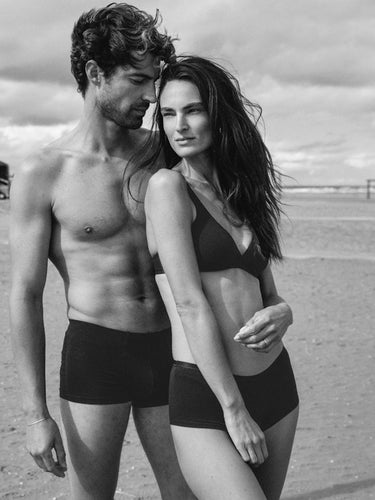 Couple posing on beach Women is  wearing Cotton Sensation bra and panties and man is wearing boxer briefs
