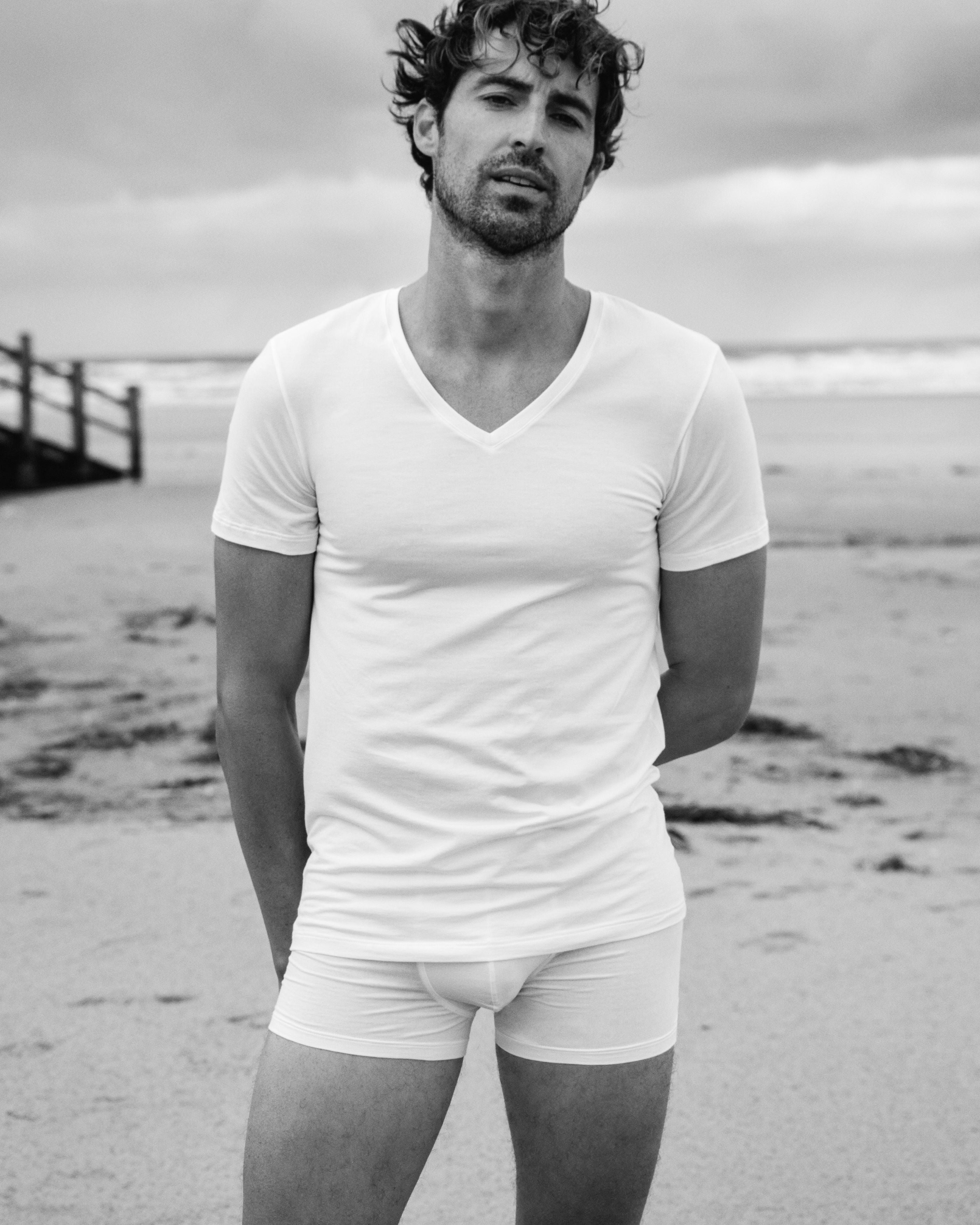 Man standing on the beach, wearing a Cotton Superior V-neck T-Shirt and Boxer Briefs.