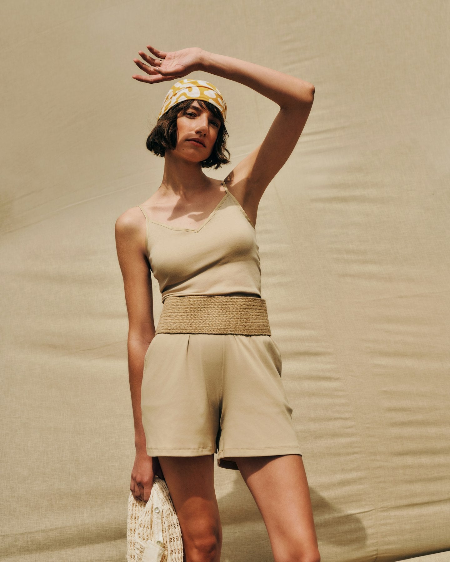 Woman posing, wearing the Iced Cappuccino Cotton Seamless Camisole, paired with the Golden Ornament Cotton Blend Scarf.