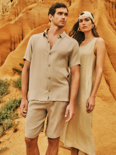 Man and Woman in desert wearing Urban Casuals Shirt & Shorts and Dress
