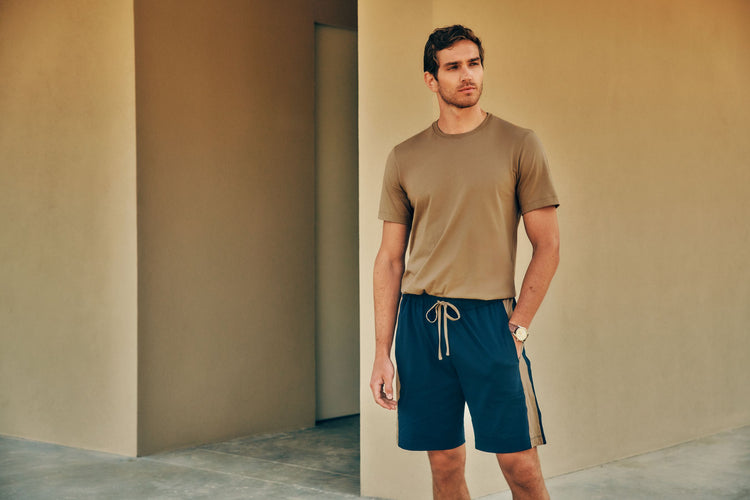 Man wearing Living Shirts t-shirt and Night & Day shorts