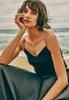 Women on beach wearing Style Icon Cotton Seamless V-Neck Cotton Camisole in Deep Navy
